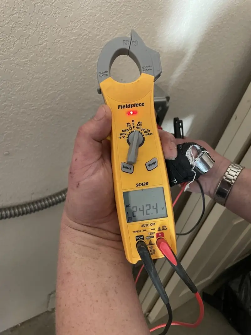 Voltage testing with clamp meter during Outlet Installation in Mount Hood Villages